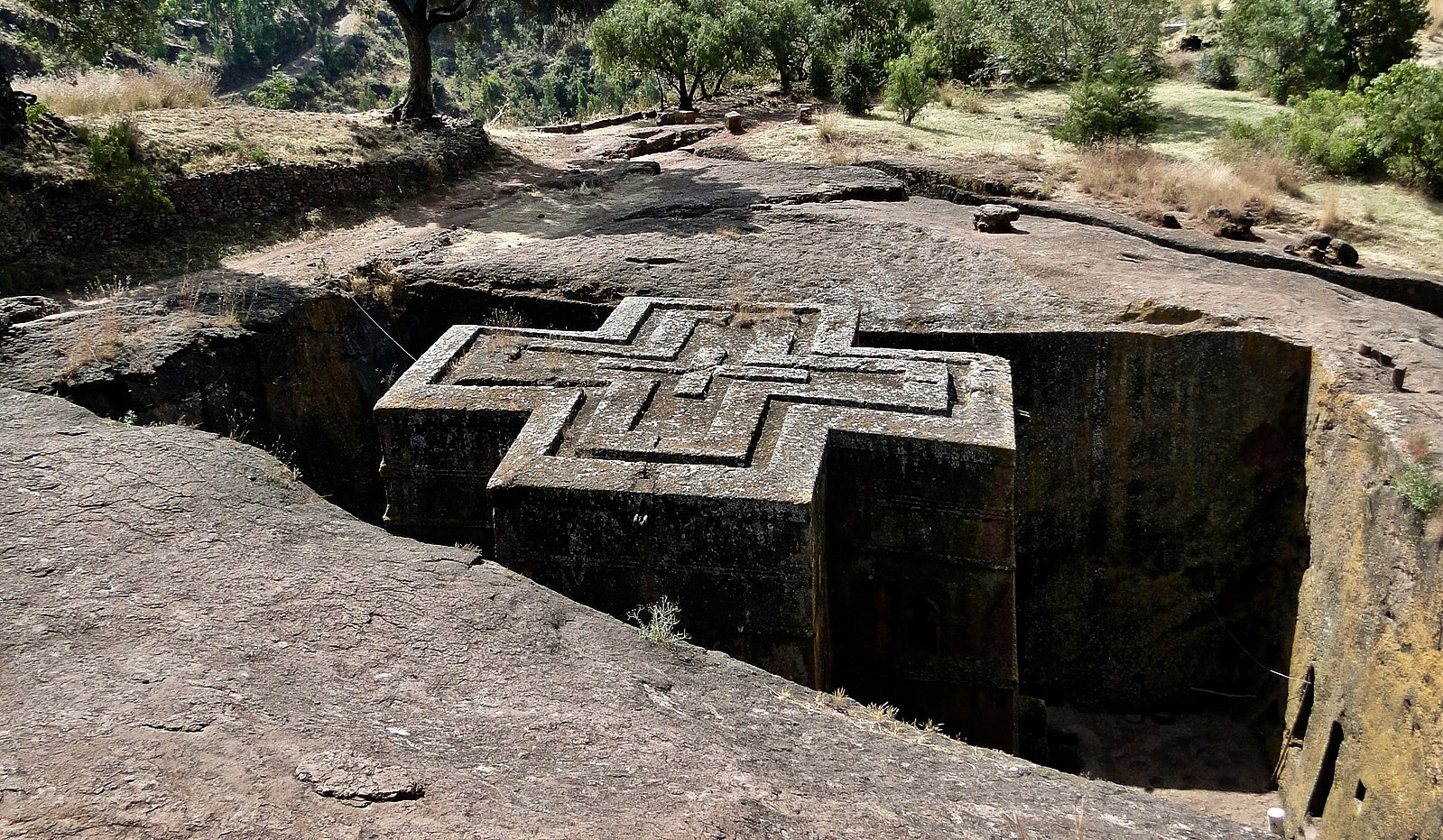 Priest in Bet Danaghel Church holding the Cross of King Lalibela. The  rock-hewn churches of Lalibela make it one of the greatest  Religio-Historical sites not only in Africa but in the Christian